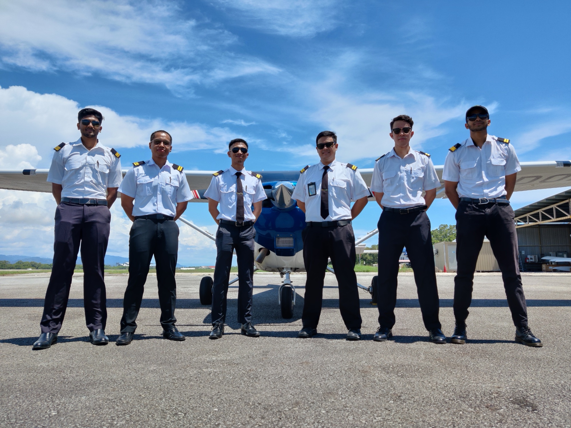 LLFA cadets standing with a Cessna training aircraft on the flight line