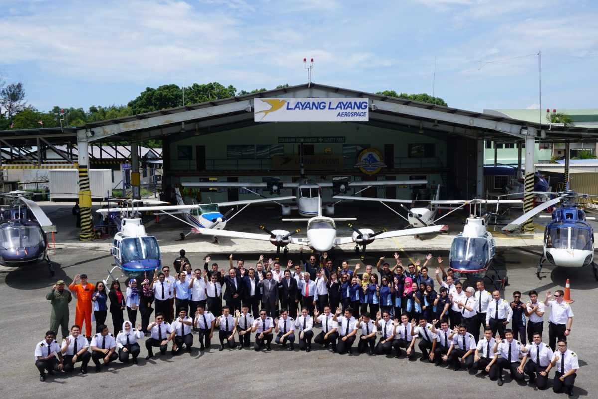 Layang Layang Flying Academy staff and cadets with the training fleet