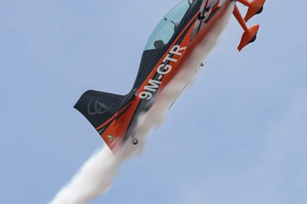 GameBird GB1 aerobatic aircraft inverted with smoke on